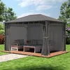 A gazebo with outdoor furniture set up on a wooden deck in a garden. Produktbild-Vorschau