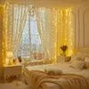 A bedroom decorated with string lights draped over curtains and a bed. Produktbild-Vorschau