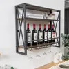 A wall-mounted wine rack with bottles and glasses. Produktbild-Vorschau