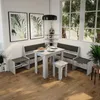 A dining nook with a table, benches, and a stool, set against a window with greenery outside. Náhled obrázku produktu