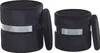 Two black velvet poufs with a silver band, one slightly smaller than the other, are shown against a white background. The lid of the larger pouf is slightly ajar. Náhled obrázku produktu