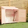 A wooden garden shed with its doors open, showing gardening tools inside, set against a wooden fence and green grass. Náhled obrázku produktu