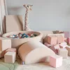A children's play area with soft play equipment and a ball pit. Produktbild-Vorschau