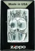 A Zippo lighter with a raised design of a woman's posterior in lingerie, presented in its packaging. Podgląd zdjęcia produktu