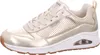 A side view of a single gold SKECHERS UNO-METALLIXS sneaker. Voir les images du produit