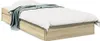 A bed frame with drawers and a blanket. Produktbild-Vorschau