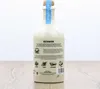 A bottle of Knut Hansen Dry Gin is shown against a light background, with a wooden surface beneath it. Voir les images du produit