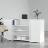 A white reception desk with shelves and cabinets in a modern office setting. Anteprima dell’immagine prodotto