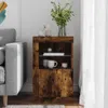 A wooden side table with decorative items on top and inside, placed next to a sofa and a white curtain. Produktbild-Vorschau