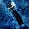 A GoPro action camera with a floating grip is submerged in blue water. Produktbild-Vorschau