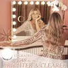 A woman is sitting at a vanity table with a lighted makeup mirror. Podgląd zdjęcia produktu