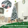 A decorated Christmas tree in a living room setting, with gifts and stockings. Produktbild-Vorschau