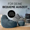 Living room with beanbag chairs and small table. Produktbild-Vorschau