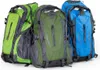 Three trekking backpacks in different colors (green, dark green, and blue) are displayed side-by-side against a white background. Podgląd zdjęcia produktu