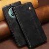 A black leather flip wallet phone case is shown on a brown and tan textured background. Produktbild-Vorschau