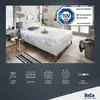 A mattress on a bed in a bedroom setting, with marketing icons and text below. Produktbild-Vorschau