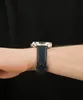 A close-up shot of a person's wrist wearing a watch. Podgląd zdjęcia produktu