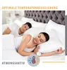 A couple sleeping peacefully in a bed with white bedding. Produktbild-Vorschau
