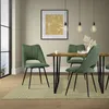 A dining room scene with chairs around a table. Náhľad obrázku produktu