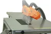 Close-up of a table saw with an orange dust collection hood and a silver blade. Náhled obrázku produktu