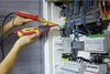 A person is using a voltage and continuity tester on an electrical panel. Náhľad obrázku produktu