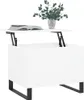 A white lift-top coffee table with black legs is shown against a white background. A book and a vase with greenery are placed on the table. Náhled obrázku produktu