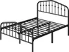A black metal bed frame with a decorative headboard and footboard, shown from a slightly elevated side angle against a white background. Podgląd zdjęcia produktu