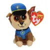A small plush toy dog wearing a police uniform and hat, with a TY Beanie Boos tag attached. Náhled obrázku produktu