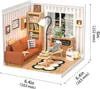 A miniature dollhouse room scene with furniture and accessories, including a sofa, bookshelf, lamp, and coffee station. Podgląd zdjęcia produktu