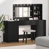 A black vanity table with a mirror and lights, a stool, and shelves with makeup products. Produktbild-Vorschau