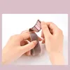 Hands are shown attaching a pink and gray fabric strap with velcro to a device. Náhľad obrázku produktu