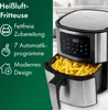A close-up of an air fryer filled with french fries, with marketing text on the left side. Produktbild-Vorschau