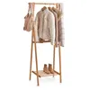A wooden garment rack with clothes and a handbag hanging on it, and boots on the bottom shelf. Produktbild-Vorschau
