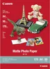 A collection of paper crafts and photos displayed on a red background, advertising Canon Matte Photo Paper. Podgląd zdjęcia produktu