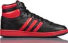 A studio shot of a single black and red Adidas sneaker. Podgląd zdjęcia produktu