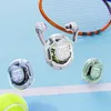 Three transparent wireless earbuds cases with digital displays showing battery percentage, placed on a blue surface resembling a tennis court, with tennis balls and a tennis racket in the background. Voir les images du produit