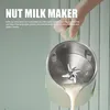 A hand holding a nut milk maker with milk pouring out. Anteprima dell’immagine prodotto