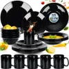 A collection of black dinnerware and mugs is displayed on a white background, with some food items and decorative elements. Produktbild-Vorschau