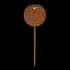 A solar garden light with a decorative, perforated sphere on a stake. Produktbild-Vorschau