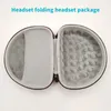 An open headset storage case with a mesh pocket on one side and a textured interior on the other. Produktbild-Vorschau