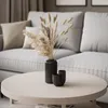 A living room scene with a couch and a coffee table. Náhľad obrázku produktu