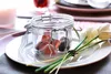 A dessert plate with a glass jar of candies and tulips. Produktbild-Vorschau