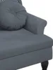 A close-up view of a dark gray velvet sofa with a round cushion. Náhled obrázku produktu