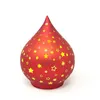 A red decorative drop-shaped light with yellow stars on a white background. Produktbild-Vorschau