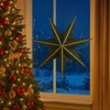 A decorated Christmas tree and a hanging star decoration in front of a window with a snowy landscape outside. Produktbild-Vorschau