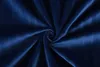 A close-up, swirling view of dark blue velvet fabric. Produktbild-Vorschau