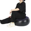A person sitting on an inflatable stool. Náhled obrázku produktu