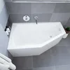 A modern bathroom with a white corner bathtub and grey tiled walls and floor. Voir les images du produit
