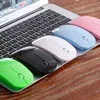 Several colorful computer mice are lined up on a laptop keyboard. Produktbild-Vorschau