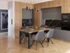 A dining table and chairs set in a modern kitchen/dining area. Produktbild-Vorschau